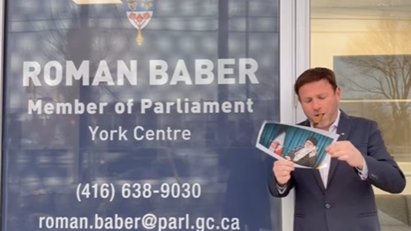 Canada MP joins viral Iran protest trend, lights cigar with burning portrait of Khamenei